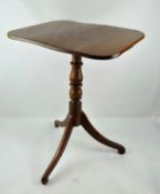 A Georgian mahogany tripod occasional table, on turned baluster stem and scroll legs,