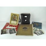 A collection of postcards, a photo album and Coronation memorabilia,