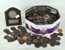 A collection of coins, comprising mostly circulated GB pennies,