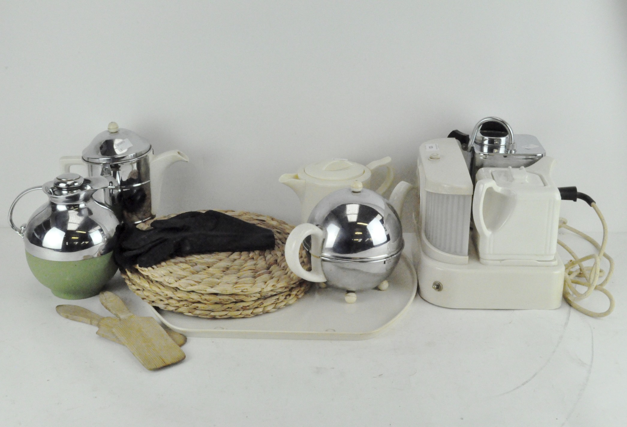 An assortment of retro tea wares, including a Thermos model 70 chrome flask,