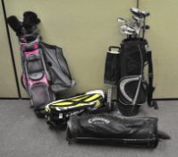 A large quantity of sporting equipment, including golf clubs, tennis rackets,