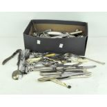 A collection of vintage silver plated and stainless steel flatware, tongs and other items