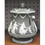 A Wedgwood dipped green, 'dancing hours' jasperware biscuit barrel and cover,