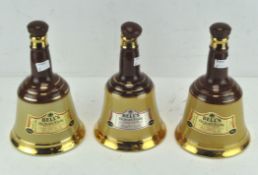 Three 20th century Bells old scotch whisky wade ceramic decanters,