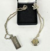 A silver ingot on chain, together with a silver chain with hanging fob watch,