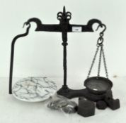 A set of early 20th century cast iron dairy scales,