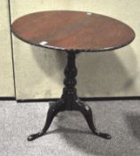 A 19th century round mahogany bird cage tilt table with carved rim,