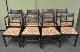 Eight Regency mahogany dining chairs on turned legs including two carvers,