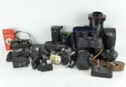 A collection of assorted camera and visual equipment