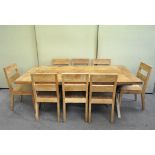 A modern refectory style dining table and eight dining chairs,