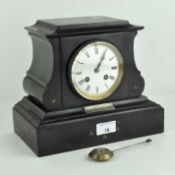 A Victorian slate mantel clock, with white enamel dial and Roman numerals,