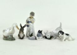 A collection of Royal Copenhagen figures, comprising dogs, mice, a rabbit, a duck and a young woman,