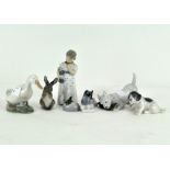 A collection of Royal Copenhagen figures, comprising dogs, mice, a rabbit, a duck and a young woman,