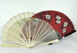 Three 19th and 20th century fans, one with bone guards and sticks with a cream silk leaf,
