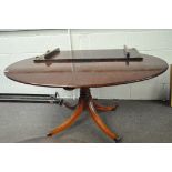 A mahogany oval table,