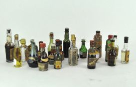 A collection of miniature bottles of spirits and alcohol, comprising Port, Whisky and more,