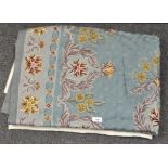 A 20th century blue ground flower patterned crewel work rug,
