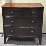 An early 20th century mahogany bow fronted chest of two over four drawers,