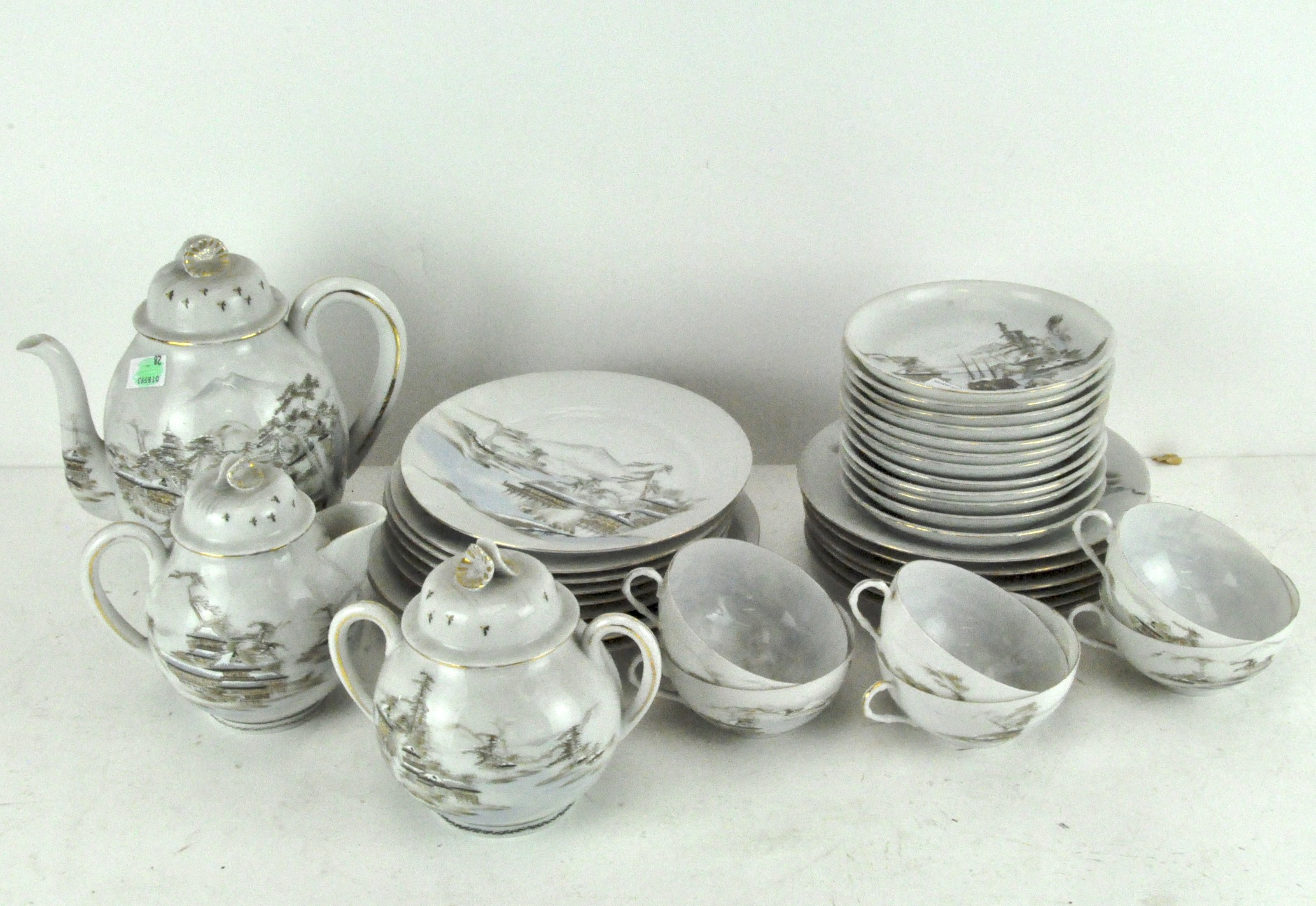 An early 20th century Japanese eggshell porcelain part tea set, - Image 2 of 2