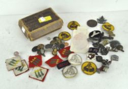 An assortment of wares, to include Military pins,