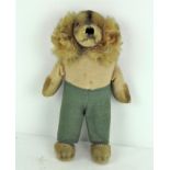 A rare 1950's Steiff Waldili Hunter dog, wearing green trousers, with yellow label and metal button,