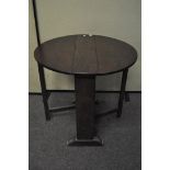 An early 20th century small oval oak gate leg side table,