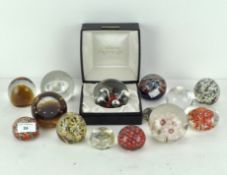 A collection of paperweights, including a boxed Caithness example, another marked Celebration,