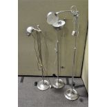 A group of three modern wall lamps, polished metal, adjustable,