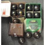 A collection of lawn bowls, to include a set by Taylor Rolph, Thomas Taylor and other makes,