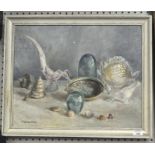 A 20th century oil on canvas, depicting a still life of shells and glassware,