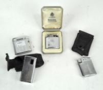 Four vintage Ronson lighters, of various designs, in silvered cases with engraved decoration,