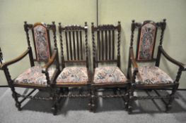 A set of two oak carvers and two chairs with barley twist details,
