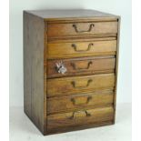 An early 20th century miniature oak collectors chest of drawers,