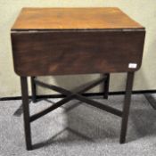 A small 19th century mahogany Pembroke table with one drawer and cross stretcher,