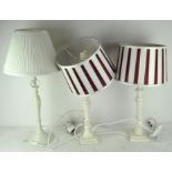 Three modern white table lamps,
