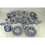 A large collection of mainly 20th century Wedgwood blue jasperware including small dishes, boxes,