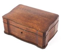 A Victorian oak folding writing slope, in shaped rectangular box edged with brass beading,