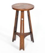 An Arts and Crafts oak occasional table, in the manner of Liberty,