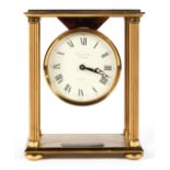 A Garrard & Co gilt brass portico style mantel clock, with a 3 1/4" dial,
