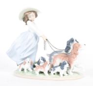 A Lladro Priviledge 'Puppy Parade' boxed figure group, printed blue marks, LZ78E, impressed 6784