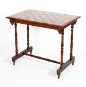 A Victorian walnut veneered chess table, the top inlaid with a chequered board,