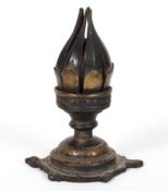An Indian brass lotus flower candle holder, the bud turning to open the petals,