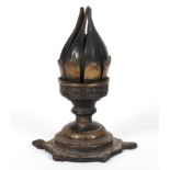 An Indian brass lotus flower candle holder, the bud turning to open the petals,