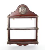 A Victorian mahogany three-tier hanging shelf, of shaped outline,