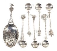 A collection of continental silver novelty spoons, comprising six smaller spoons, marked 800,