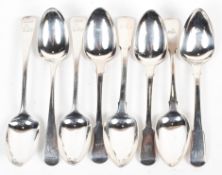 A collection of eight Georgian silver dessert spoons, various designs,