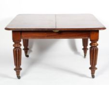 A William IV mahogany extending dining table, with two additional leaves,