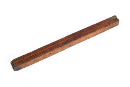 An antique folding wooden brass-mounted alcohol barrel measuring stick,