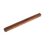 An antique folding wooden brass-mounted alcohol barrel measuring stick,