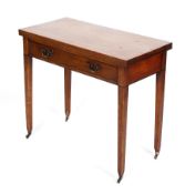 A George III mahogany folding table with frieze drawer and ebonised stringing,
